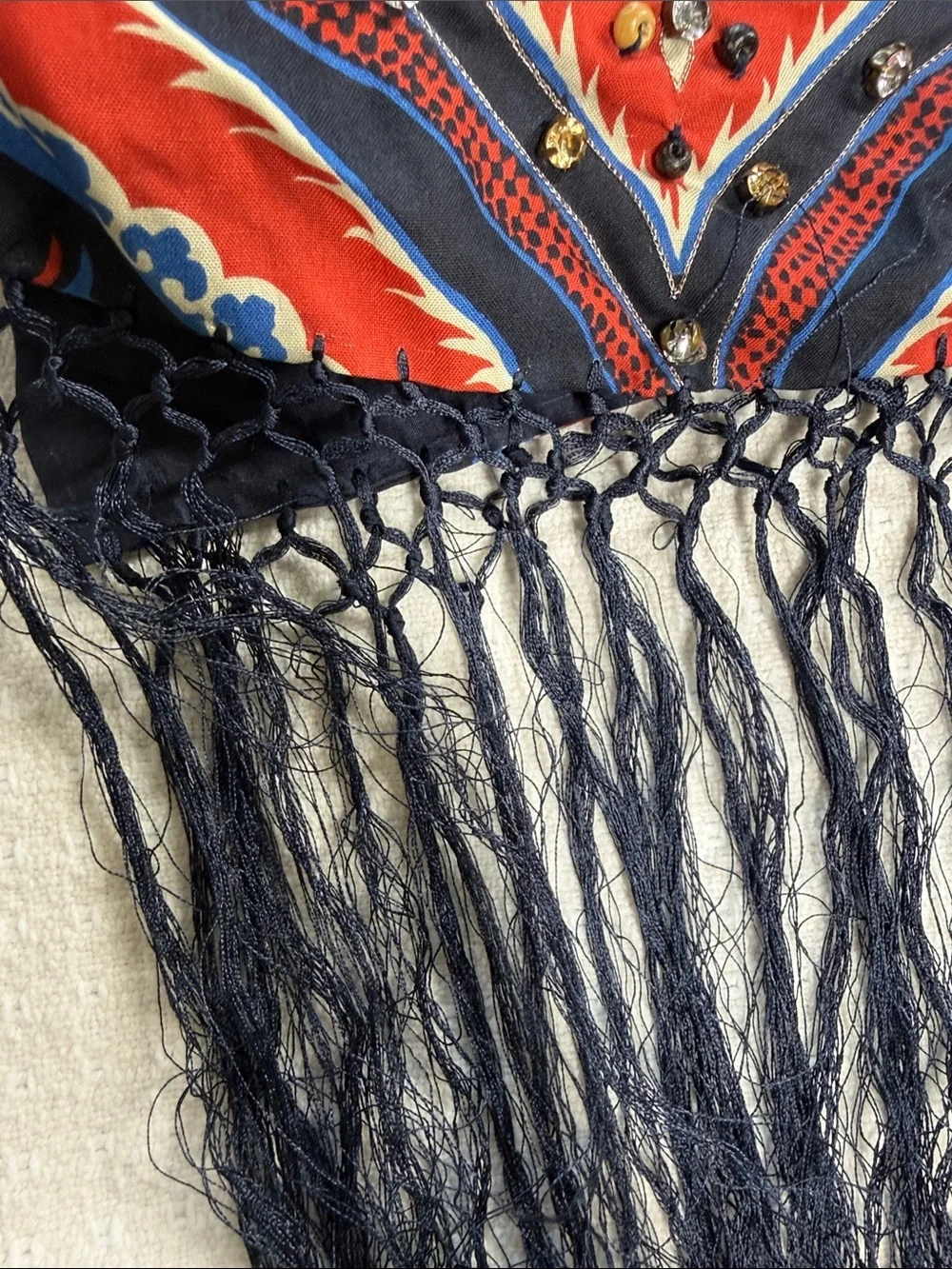 Navy bkue and red print scarf with fringe, beading, and jewel embellishments